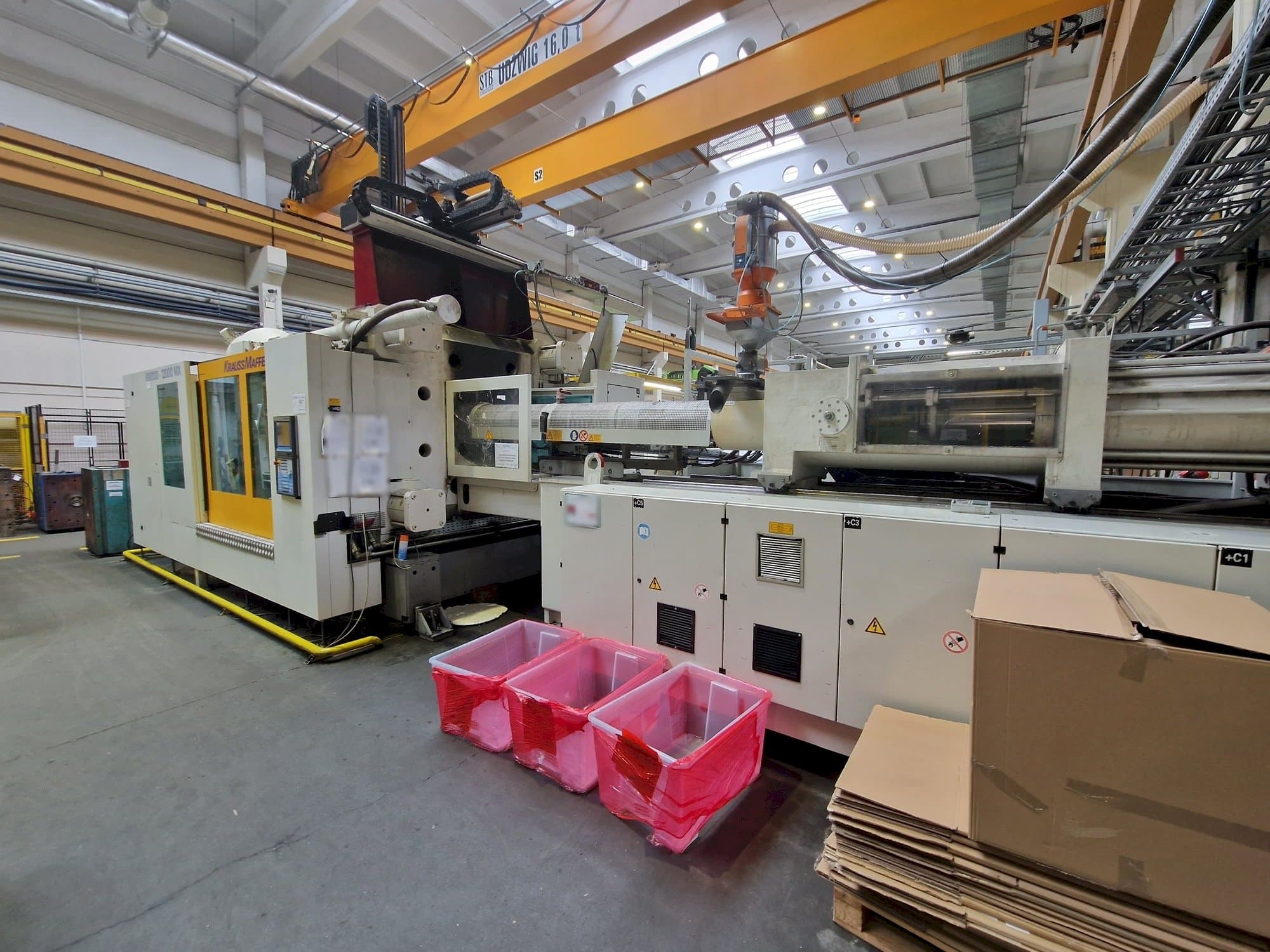 Prikaz  stroja Krauss Maffei 1100-12000 MX  sprijeda