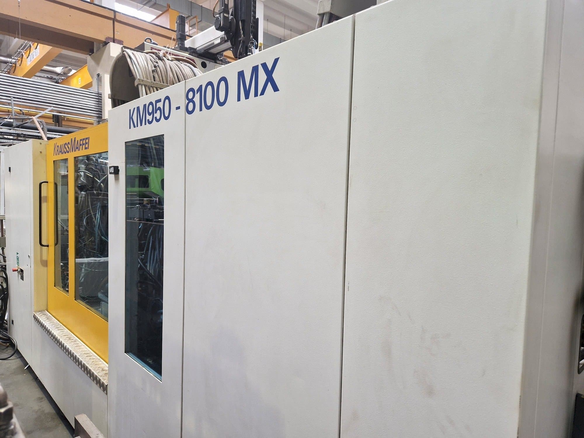 Prikaz stroja Krauss Maffei 950-8100 MX sprijeda