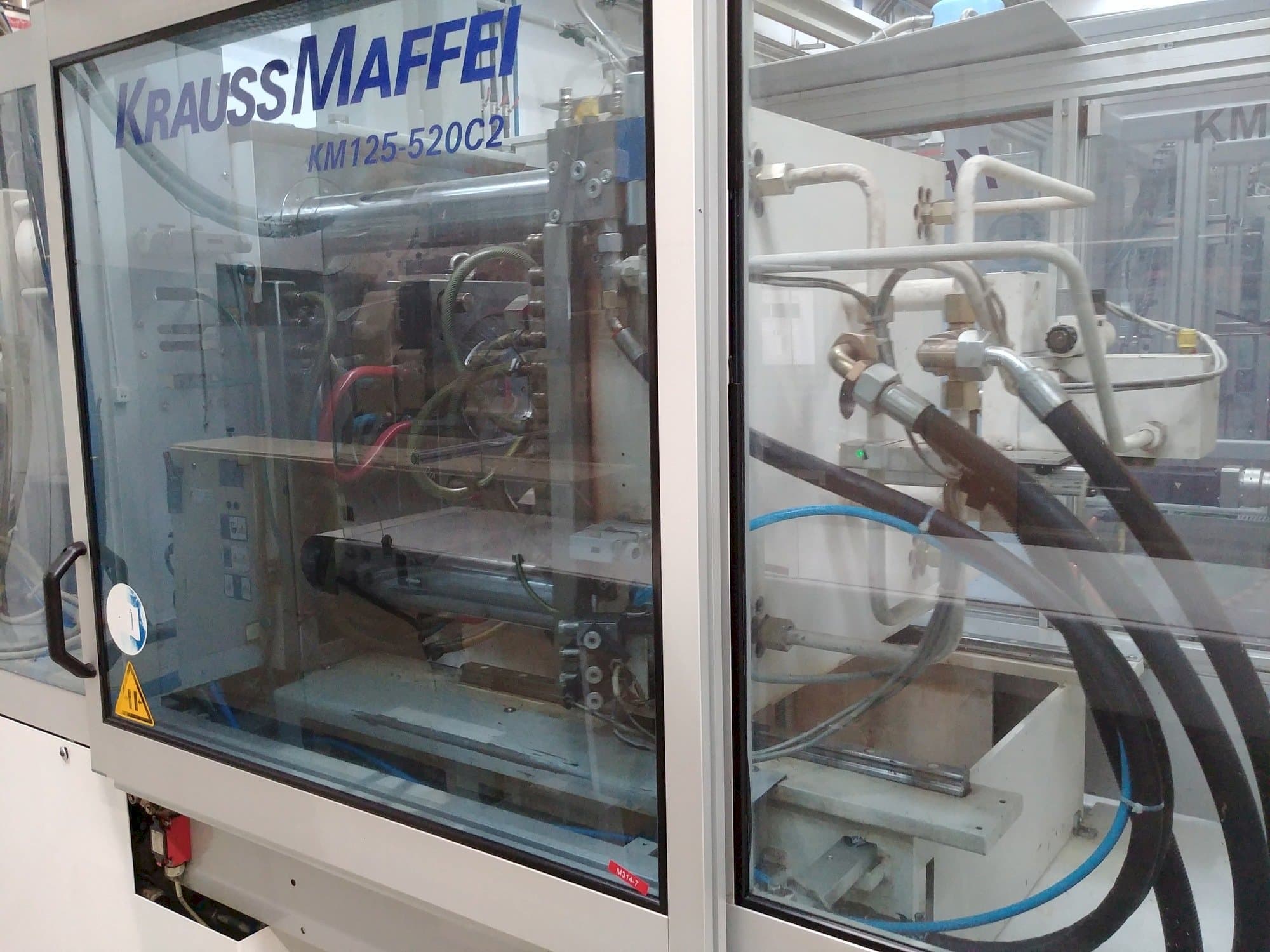 Prikaz stroja Krauss Maffei KM 125-520 C2 slijeva
