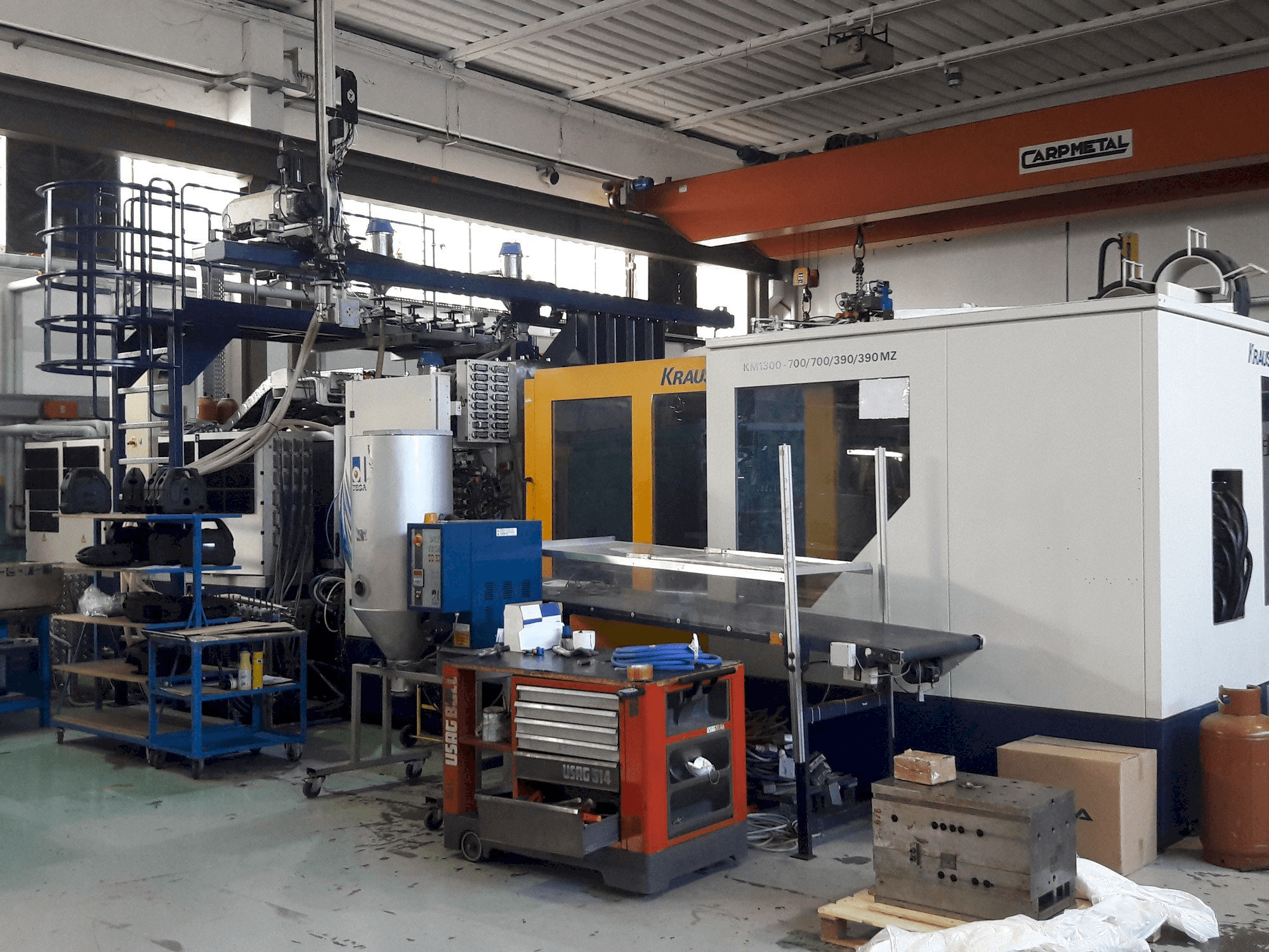 Prikaz stroja Krauss Maffei 1300-700-700-390-390 MZ sprijeda