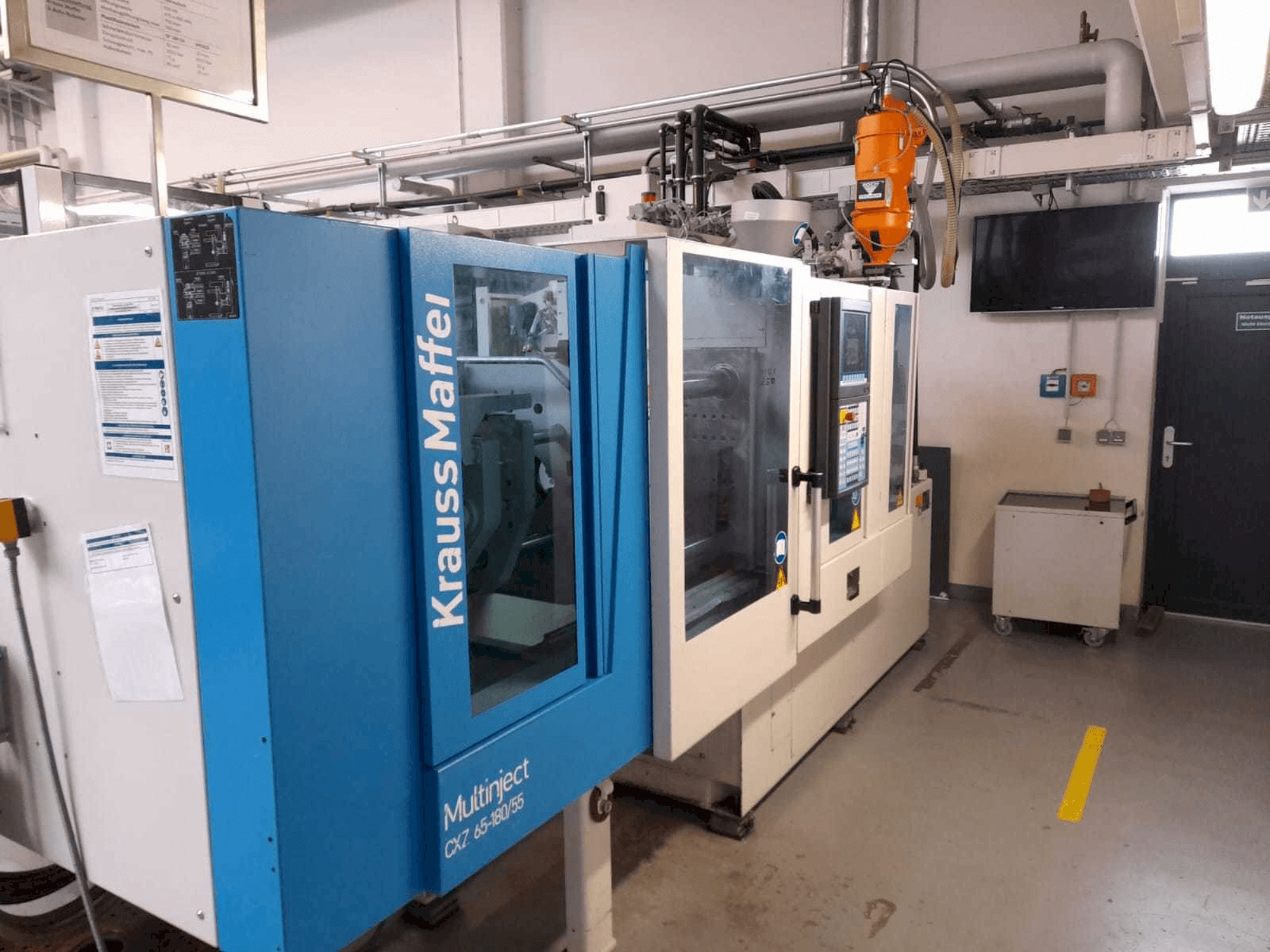 Prikaz stroja Krauss Maffei KM 65/80 CX sprijeda