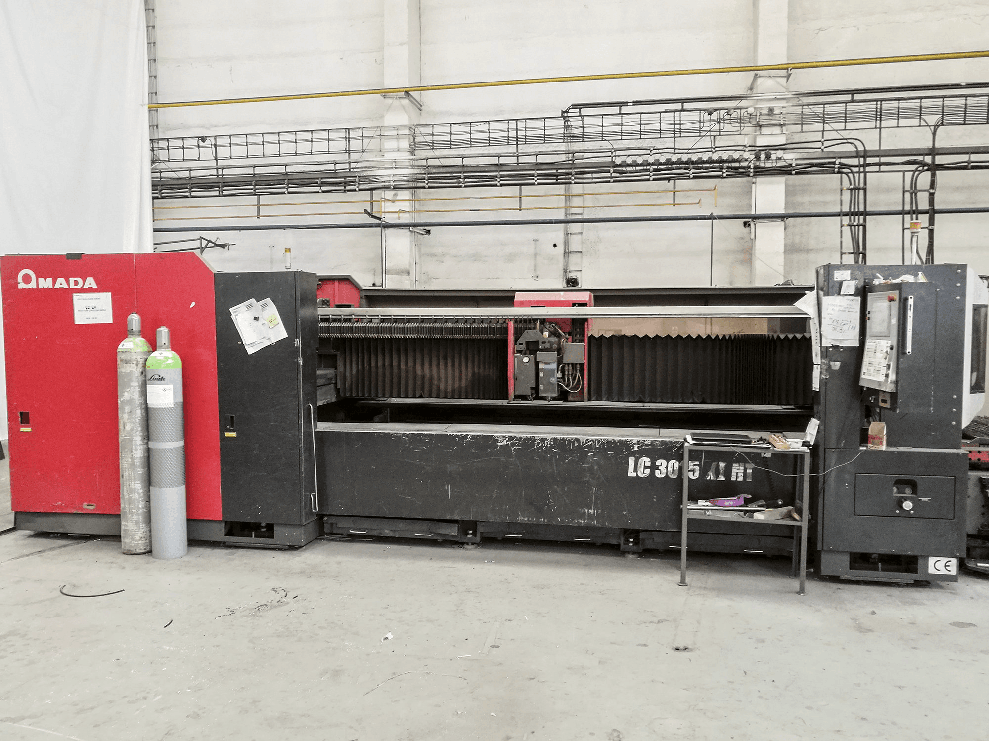Prikaz stroja AMADA LC 3015 X1 NT sprijeda