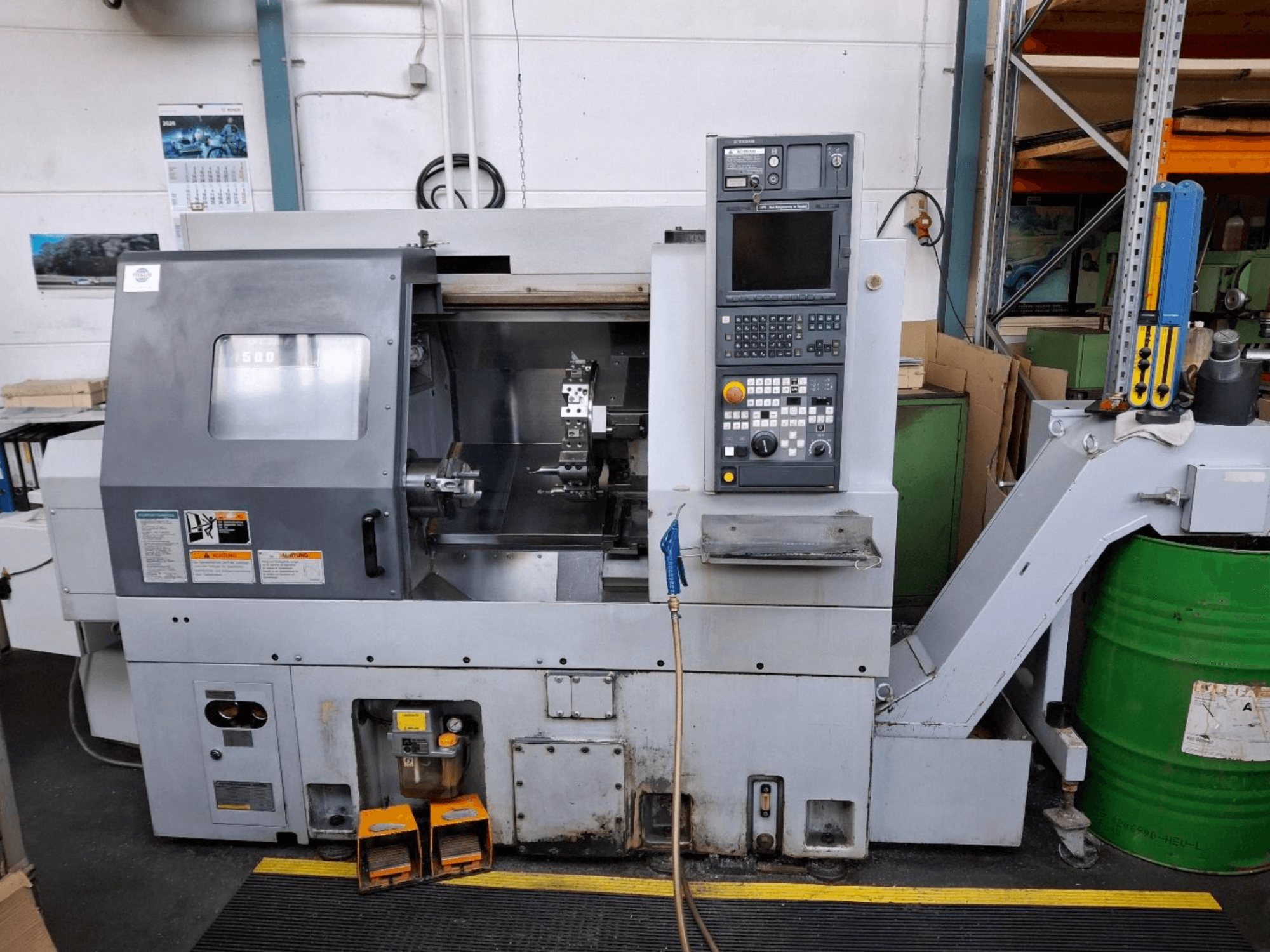 MORI SEIKI CL 1500 T horizontalni tokarski stroj, prednji pogled s upravljačkom pločom, vidljivim alatima i zaslonom rada.