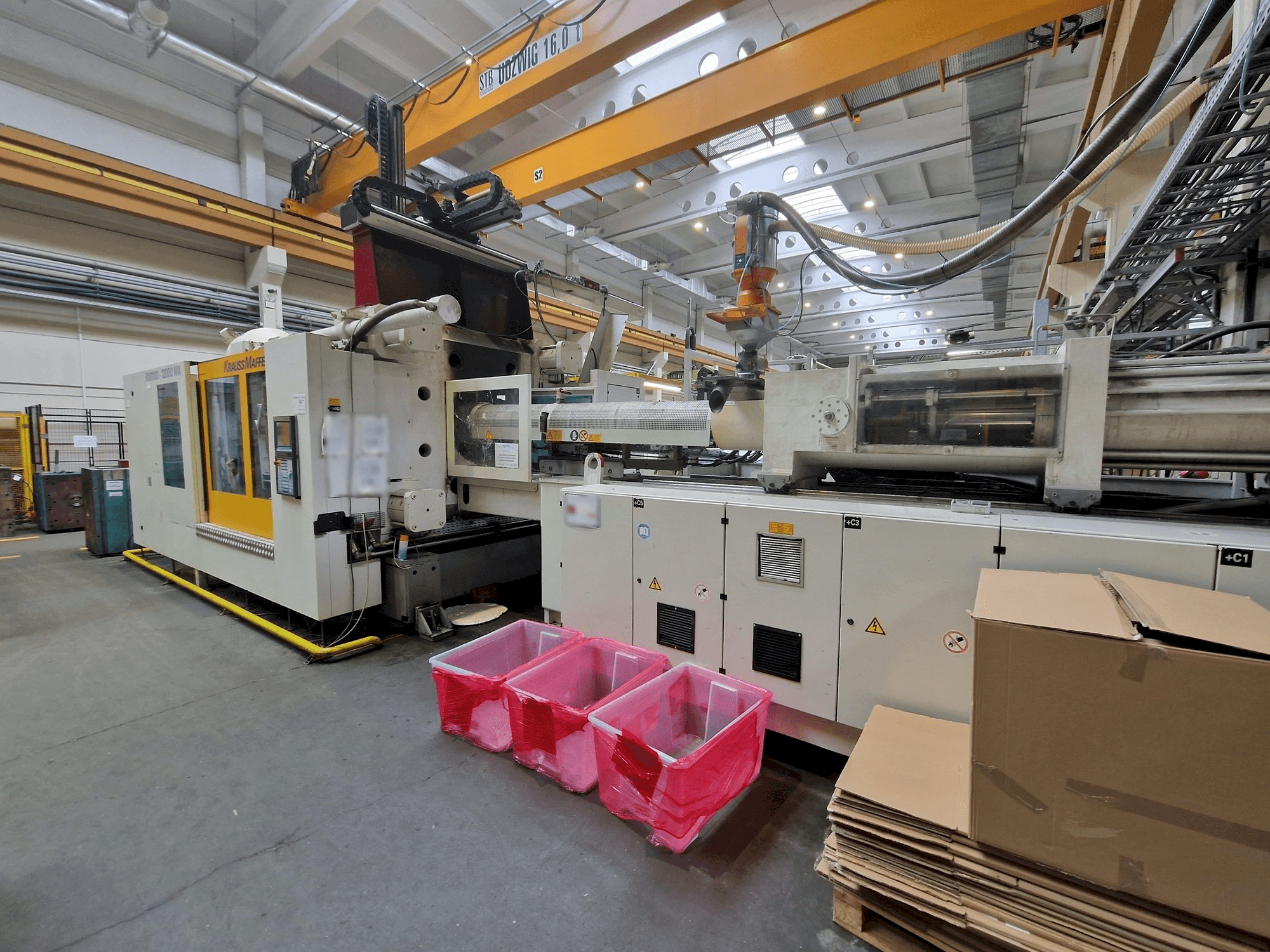 Prikaz stroja Krauss Maffei 1100-12000 MX sprijeda