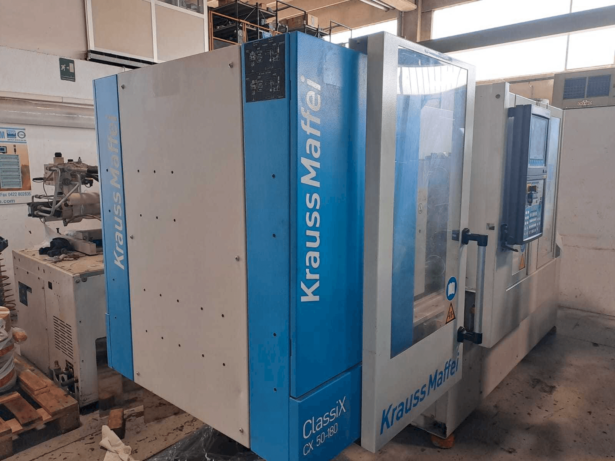 Prikaz stroja Krauss Maffei 50-180CX slijeva