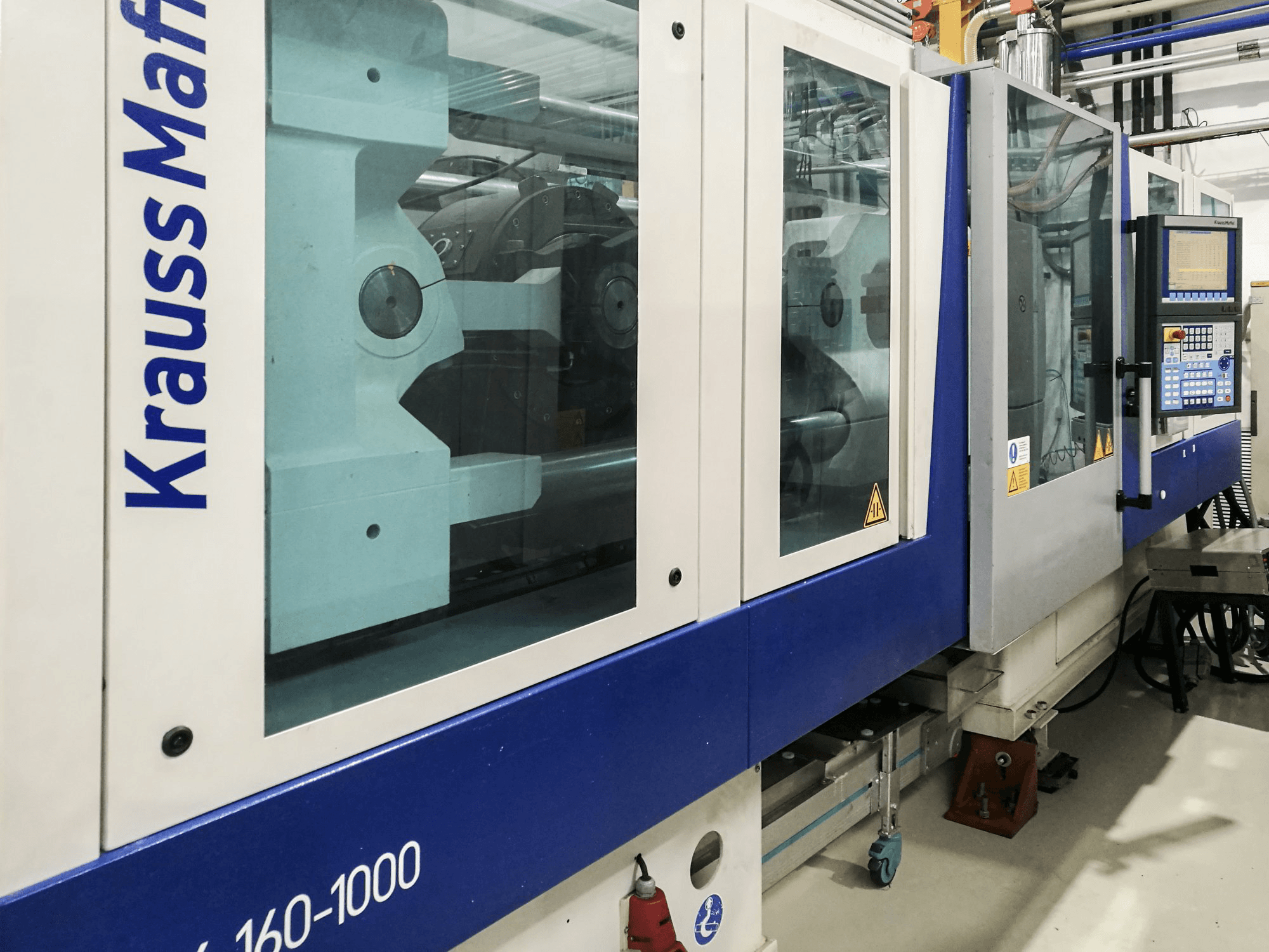 Prikaz stroja Krauss Maffei 160-1000 EX slijeva